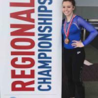 JC gymnast beaming after great year graphic